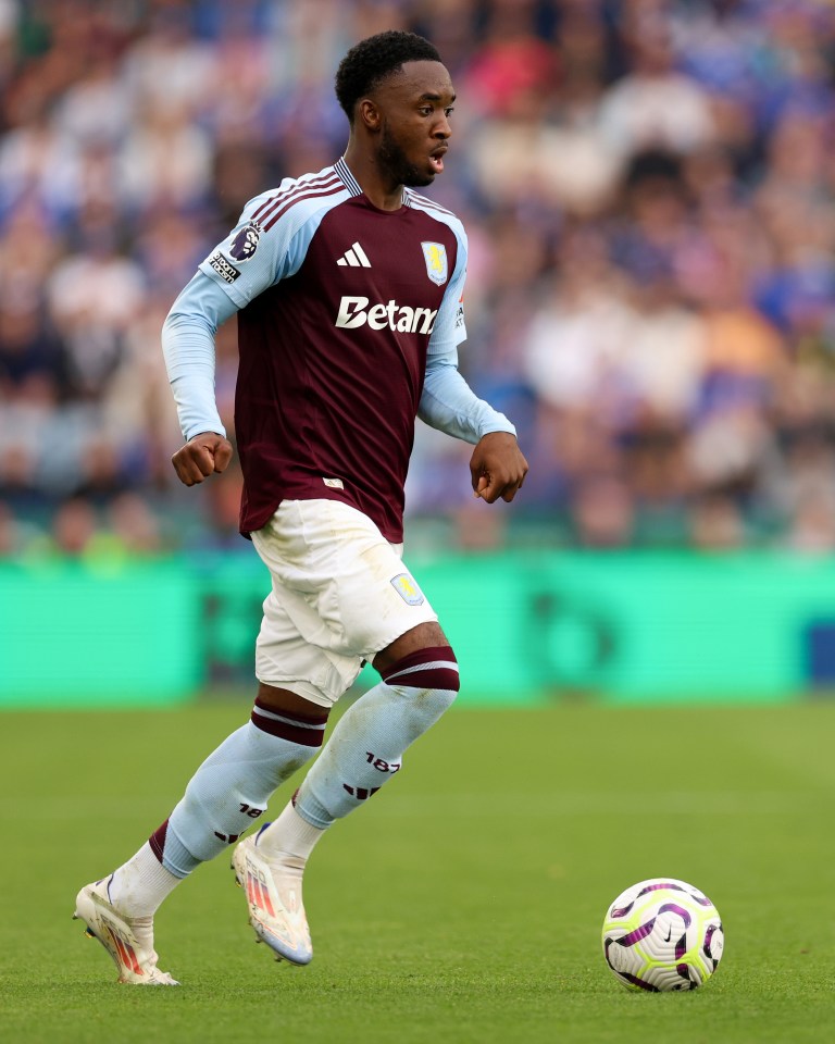 a soccer player wearing a betard jersey runs with the ball