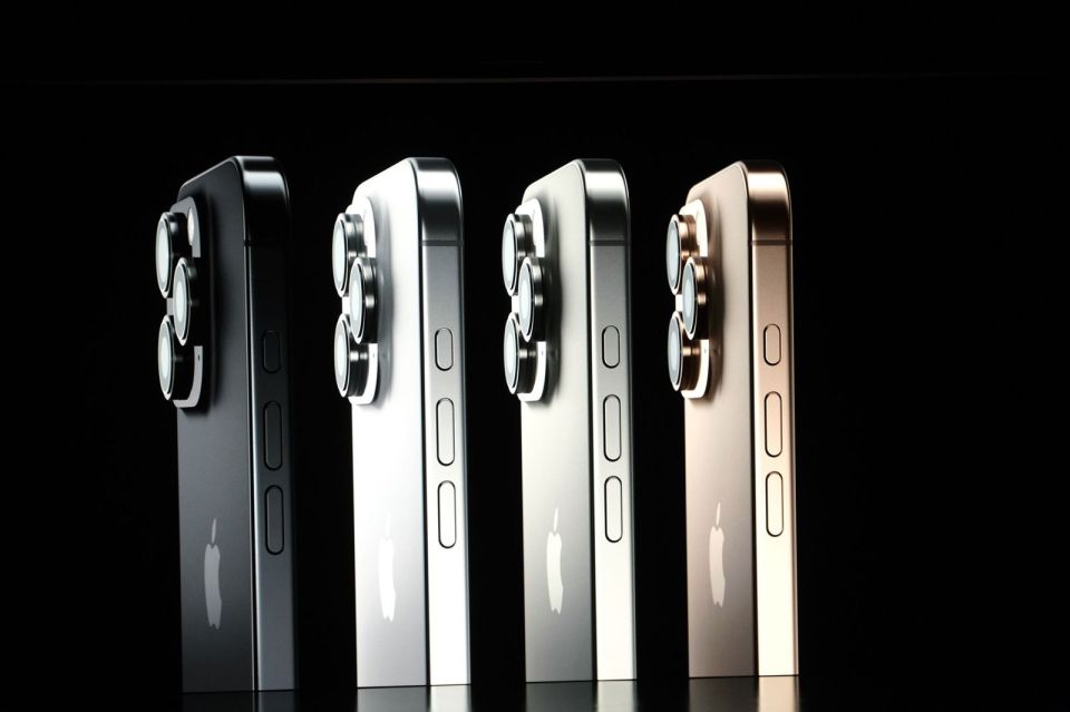 a row of iphones in different colors are lined up in a row