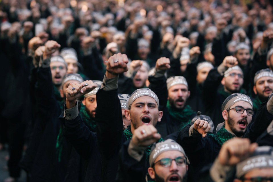 a group of men wearing headbands that say ' freedom ' on them