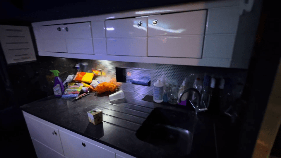 a kitchen counter with a carton of milk on it