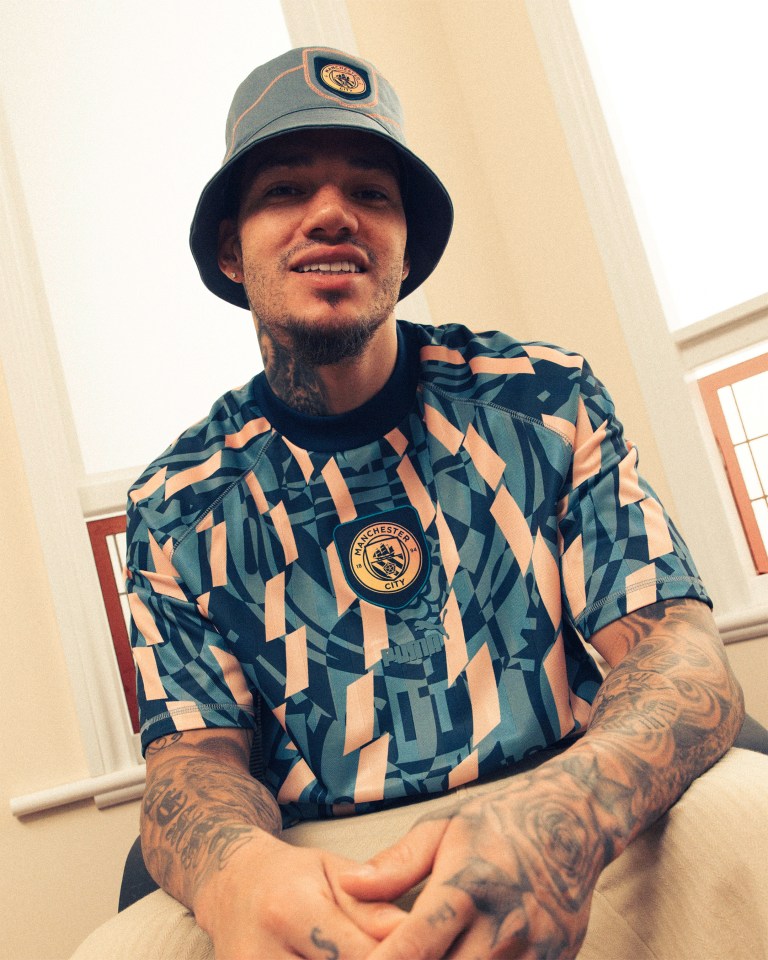 Ederson donned a snazzy top and bucket hat for the shoot