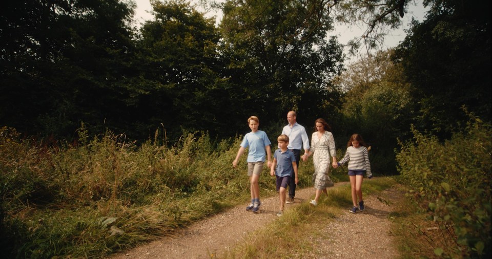 The royals are seen enjoying a walk in woodland