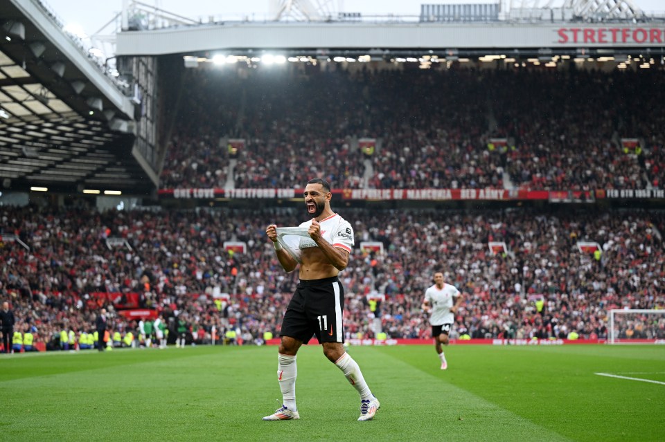 a shirtless soccer player with the number 11 on his jersey