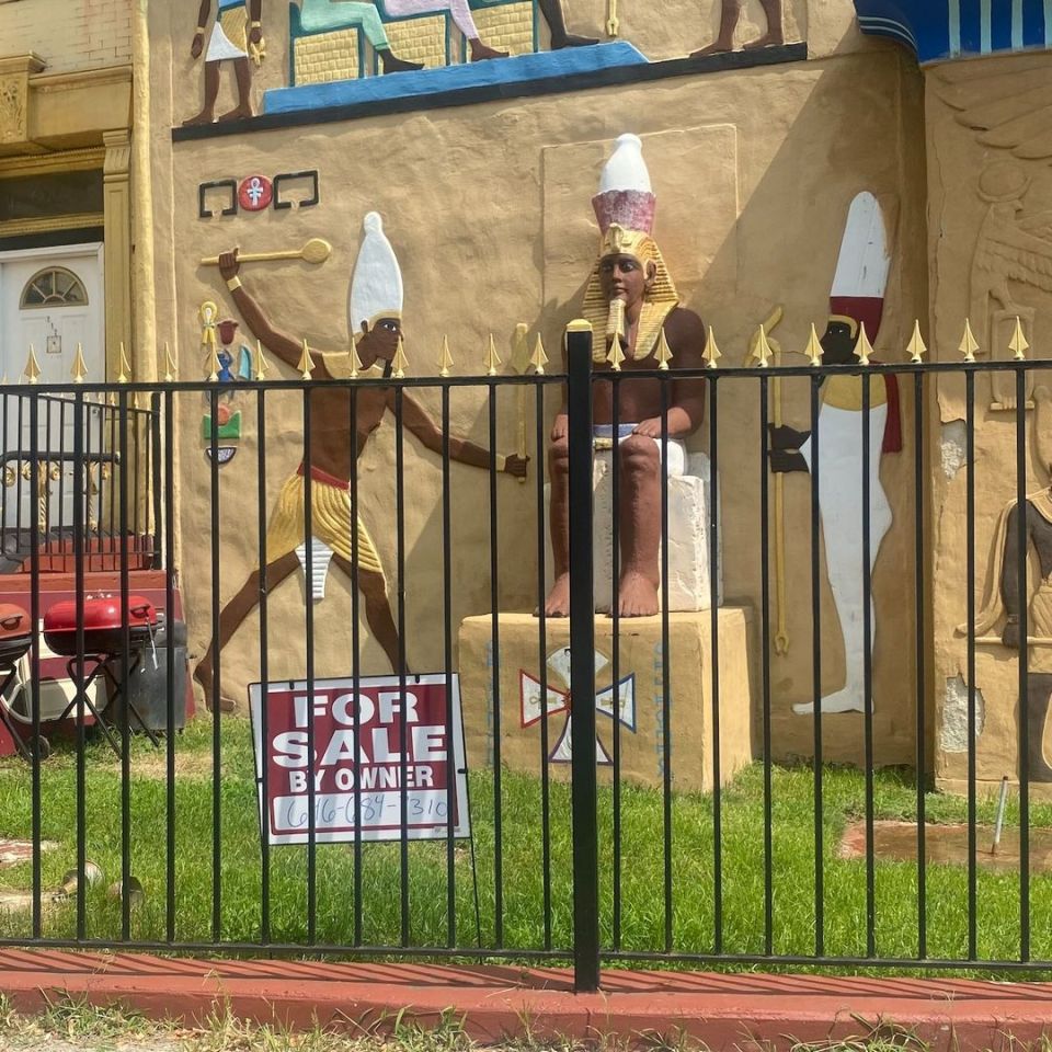 The mystery temple which has pharaoh sculptures on the front lawn is now for sale