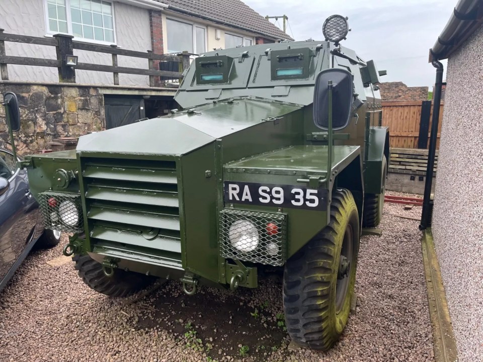 a green military vehicle with the license plate ra s9 35