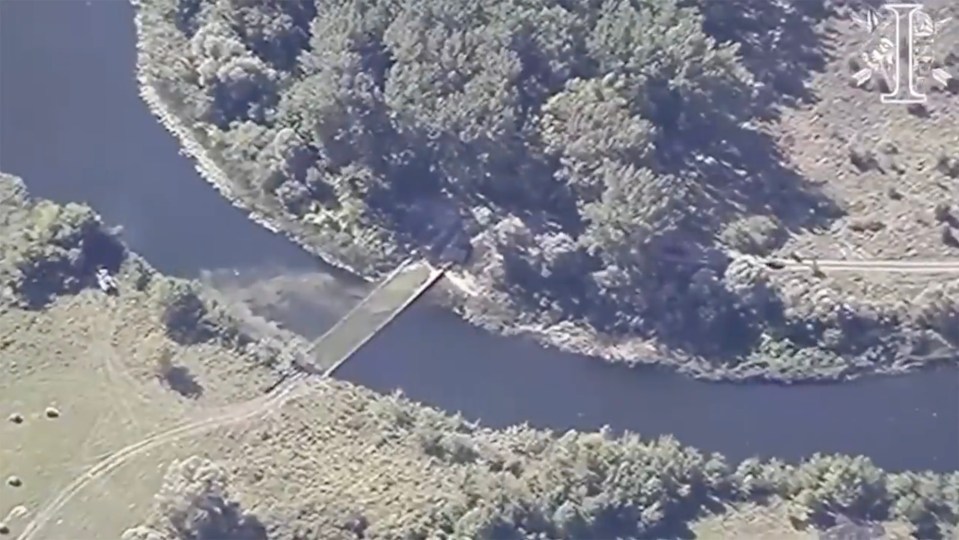 an aerial view of a bridge over a river