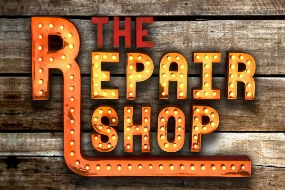 a sign that says the repair shop on it