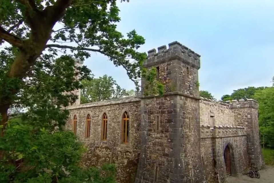 a stone building with a tower on top of it