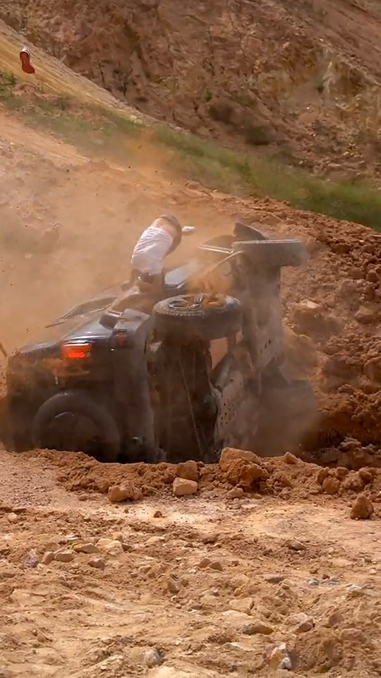 a person is riding a dirt bike on a dirt road