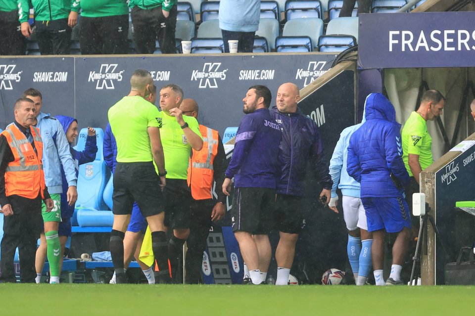 The referee called off both sets of players due to the rain