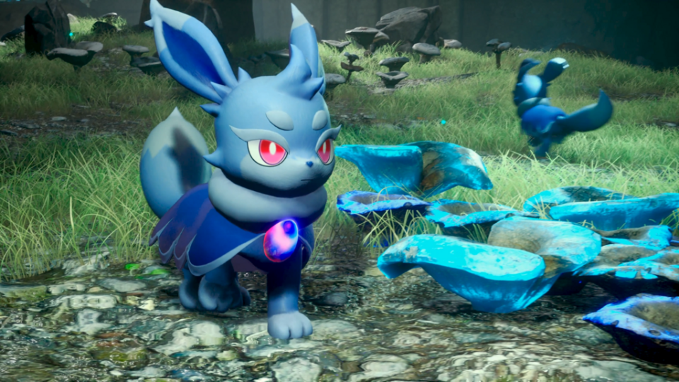 A blue rabbit-like Pal with red eyes standing in the grass