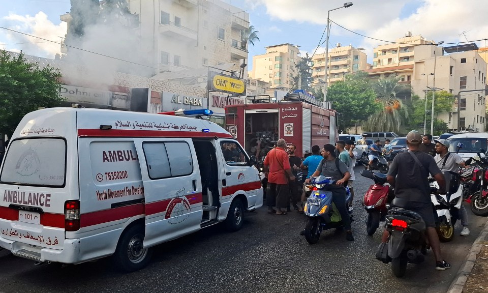 Smoke pours from a phone shop in Sidon