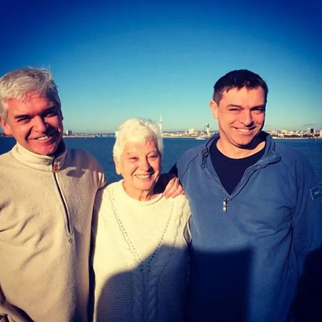 Phil with his mother Pat and brother Tim who faced sexual offence charges against a teenage boy