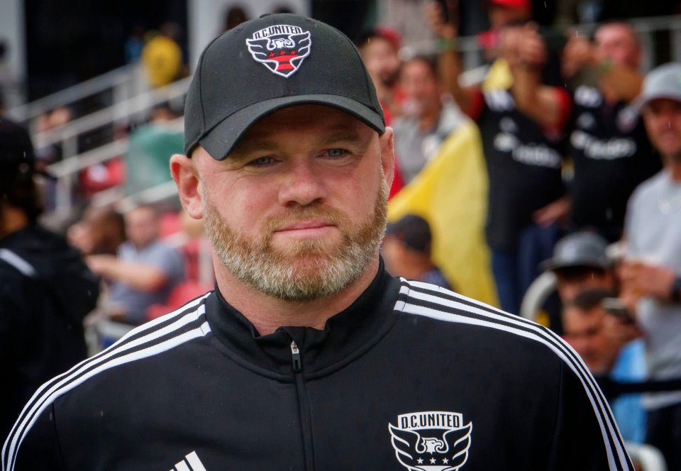 a man wearing a hat that says d.c.united on it