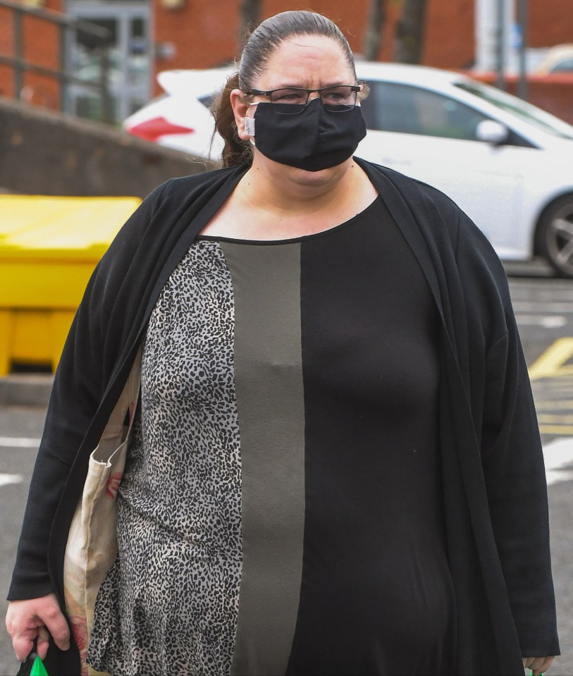 a woman wearing a black face mask and glasses