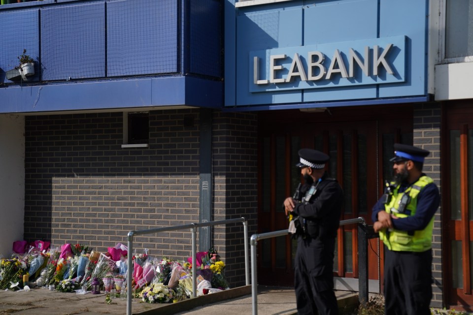 Floral tributes to the family left outside the tower block