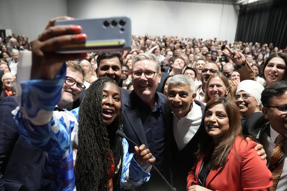 Starmer takes a selfie with Dawn Butler, MP for Brent East and Mayor of London Sadiq Khan at a reception during the Labour Party Conference