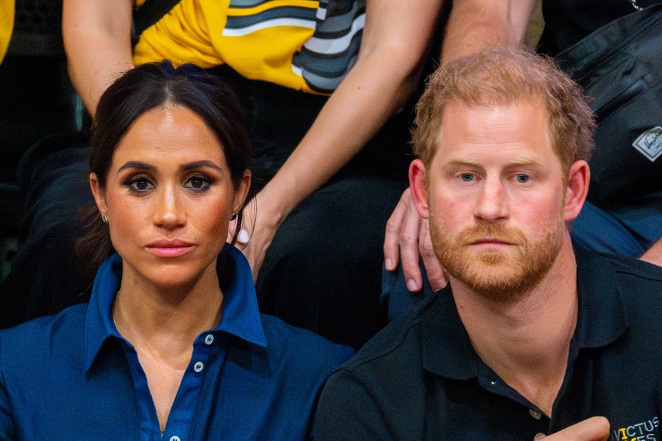 prince harry and meghan markle are sitting next to each other