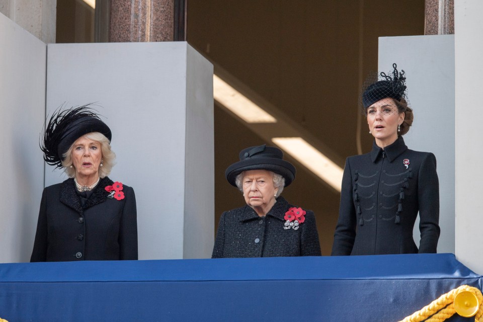 queen elizabeth ii stands between two other women