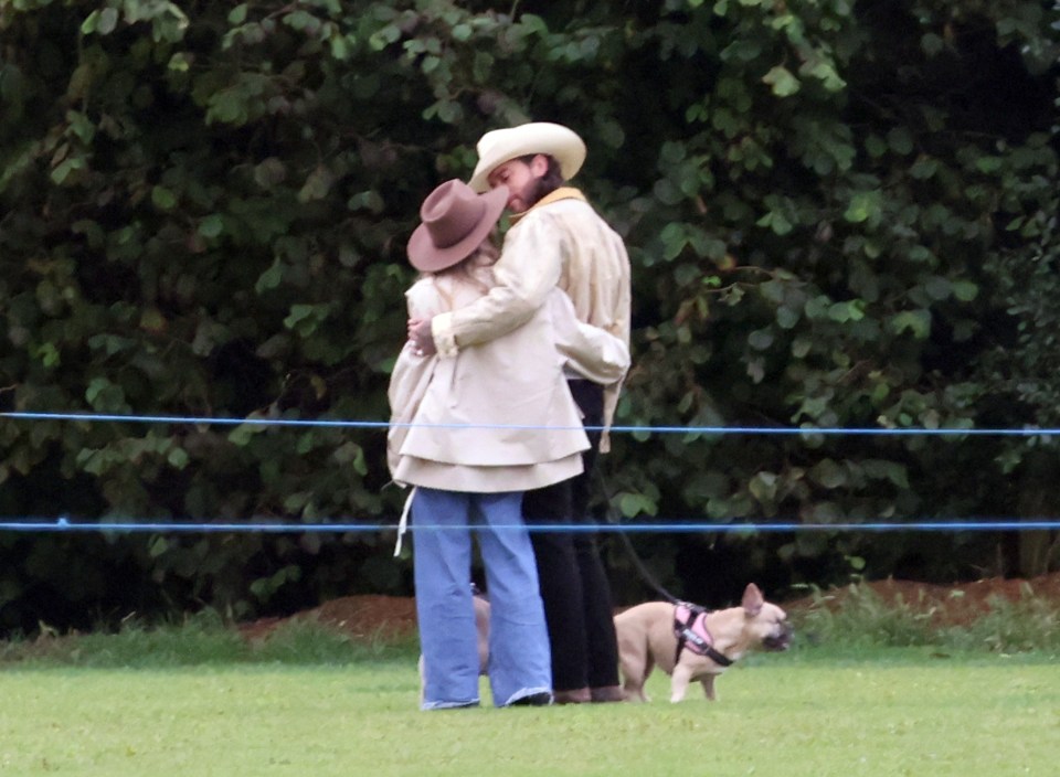 They enjoyed a cuddle as they walked Pete's two dogs