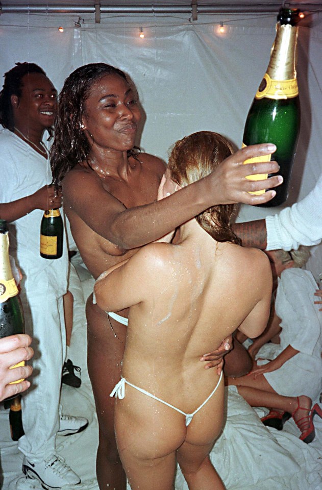 Topless guests are covered in bubbly at the rapper's 1998 party