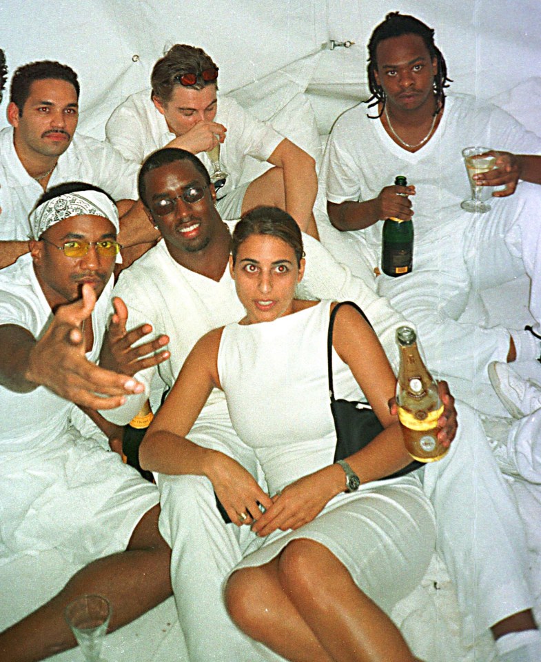 Diddy, in shades, and guests including Leonardo DiCaprio, back row, at his first White Party in 1998