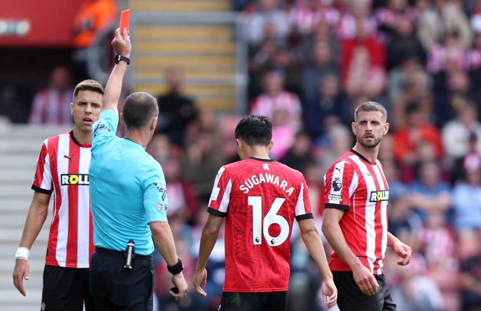 a referee gives a red card to a player named sugahara