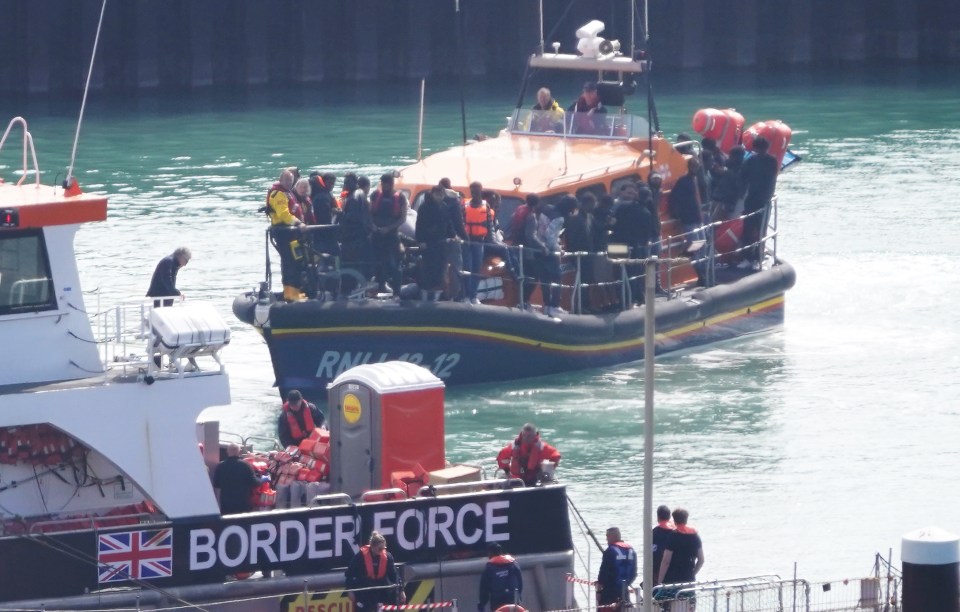 A group of people, thought to be migrants, were safely brought to shore by the RNLI