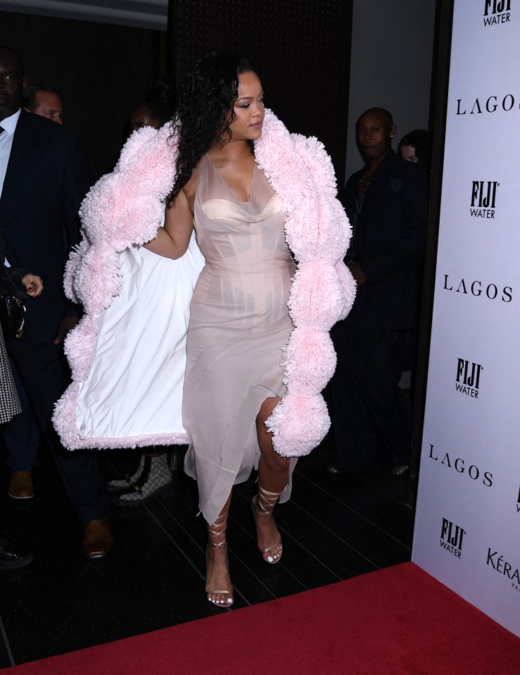 The artist wore a corset dress with a pink shearling coat at an awards bash