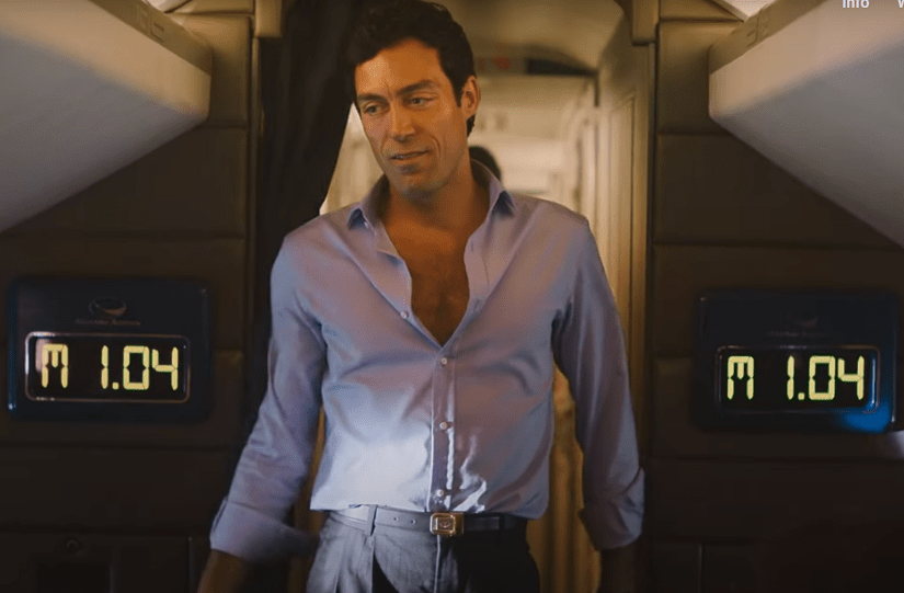 Rupert (Alex Hassell) swaggers back to his seat after raunchy encounter on plane