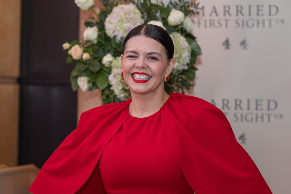 a woman in a red dress stands in front of a sign that says married first sight