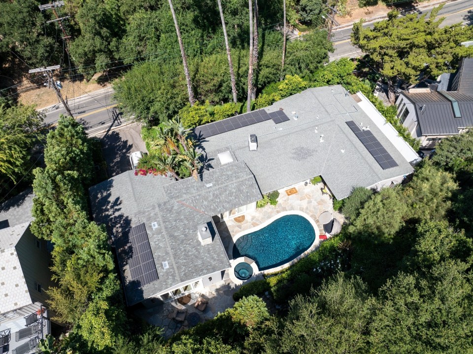 The luxury property has a pool and hot tub