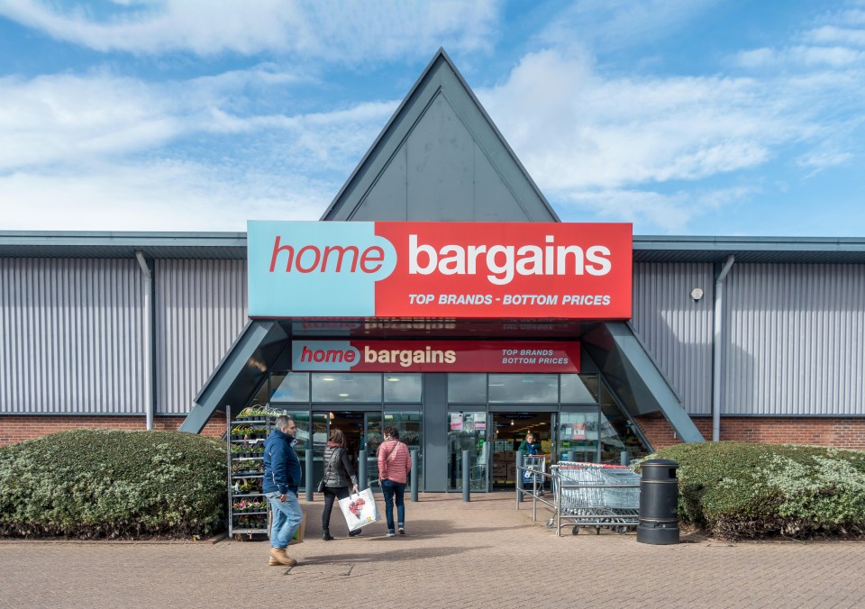 the entrance to a home bargains store with people shopping