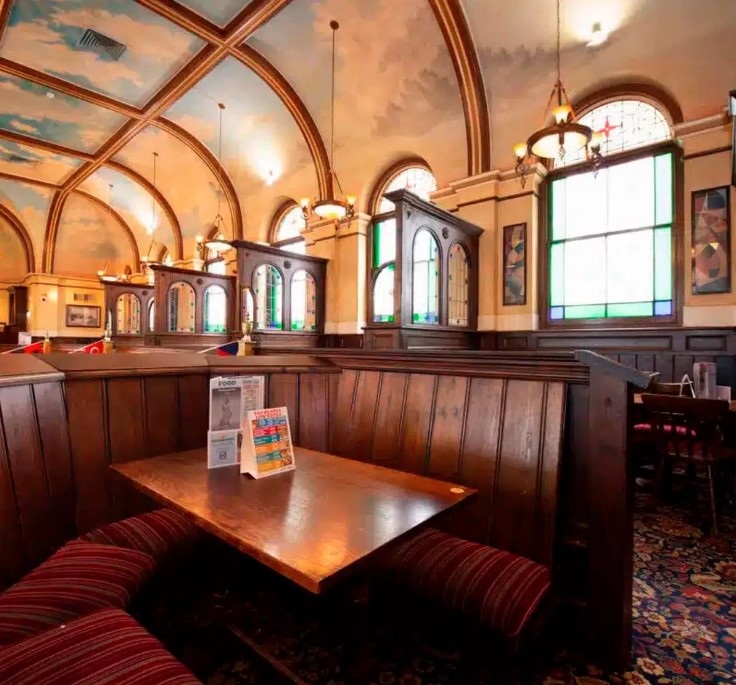 a table in a restaurant with a menu on it