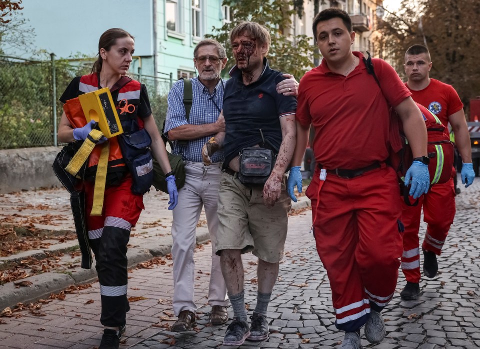 Heartbreaking pictures show a dazed and bloodied Yaroslav being held up by medics as he followed his daughter's body on a stretcher