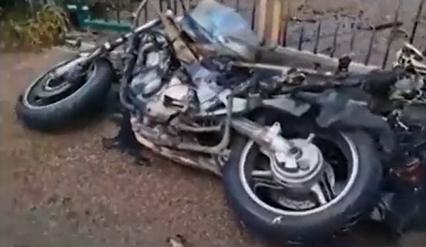 The charred remains of the motorbike set alight outside a park