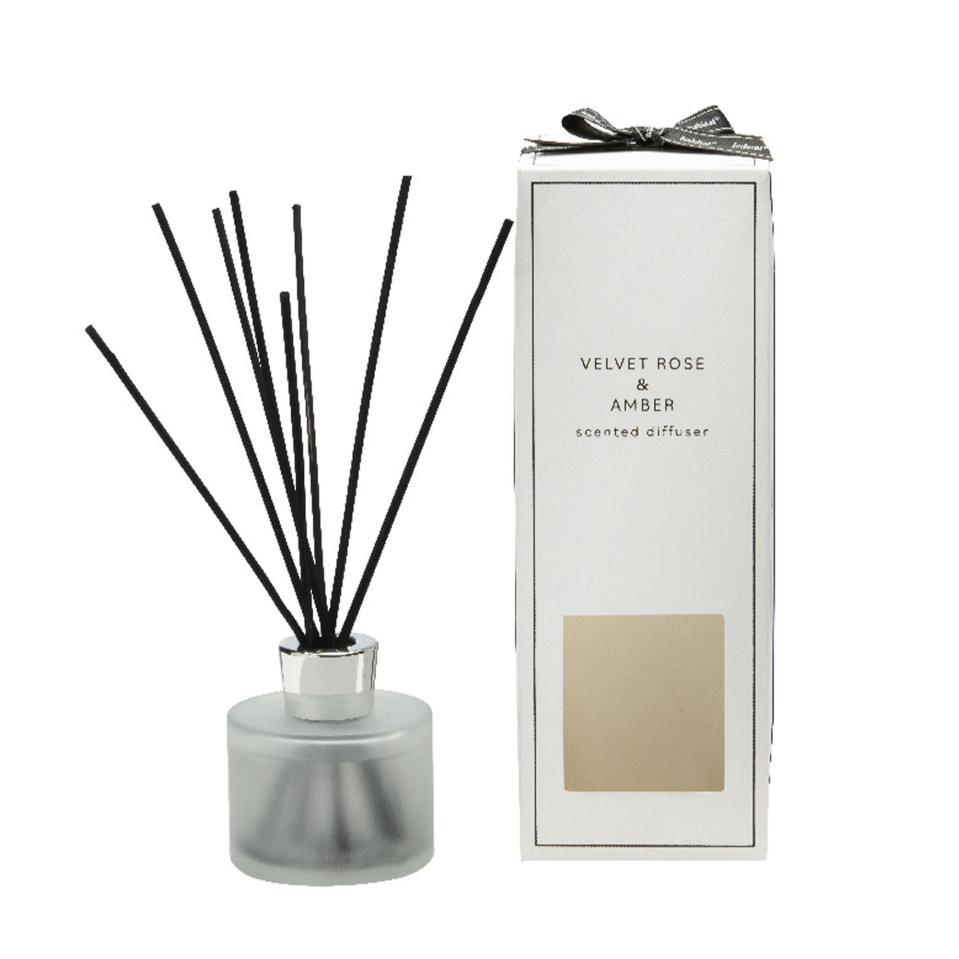 a velvet rose and amber scented diffuser with black sticks