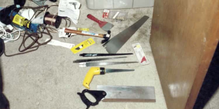 a bunch of tools are laying on the floor in a room .