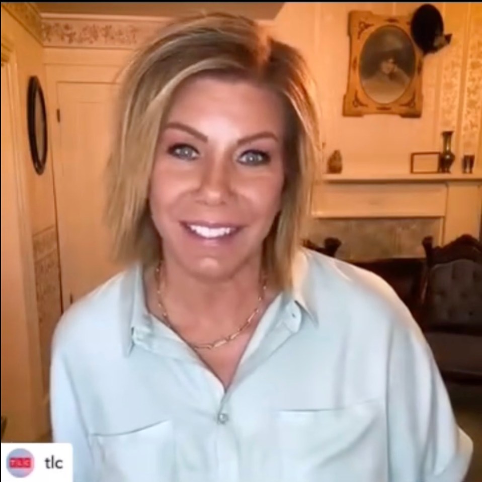 a woman is smiling in front of a fireplace and a picture frame that says tlc