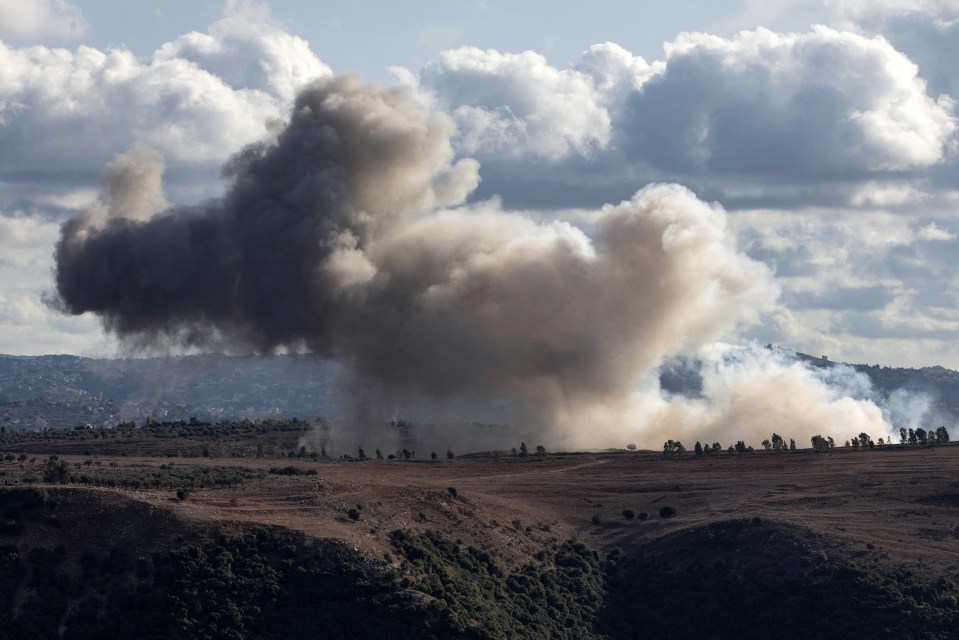 Smoke billows from the site of an Israeli airstrike on southern Lebanon border today