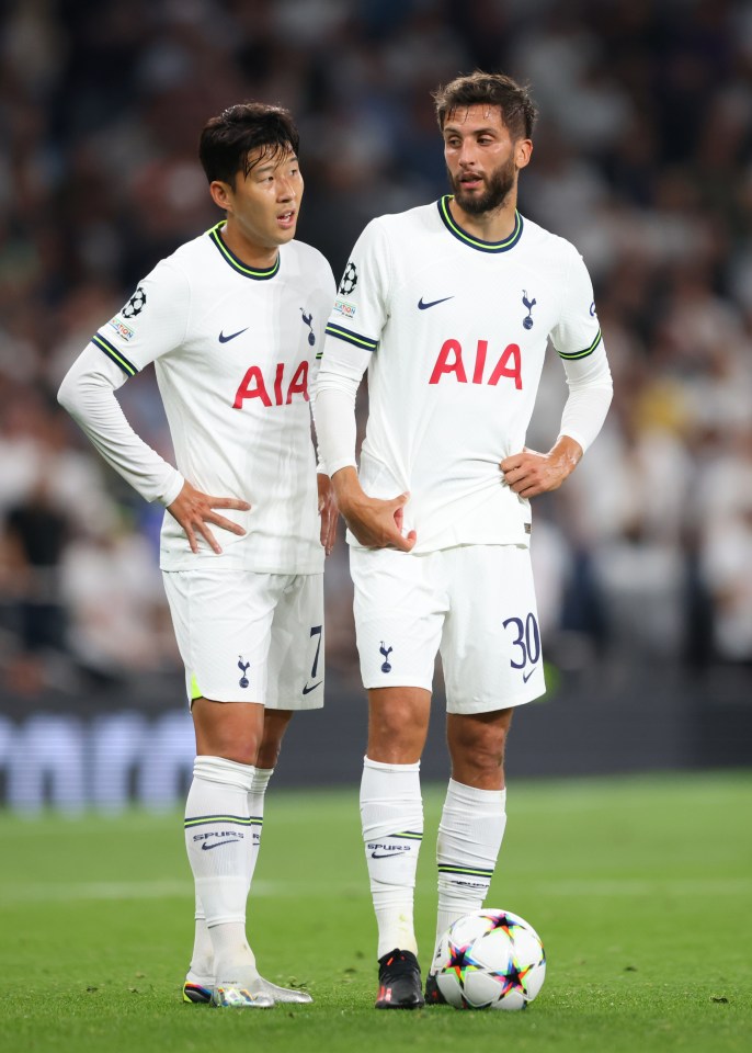 two soccer players with aia on their shirts