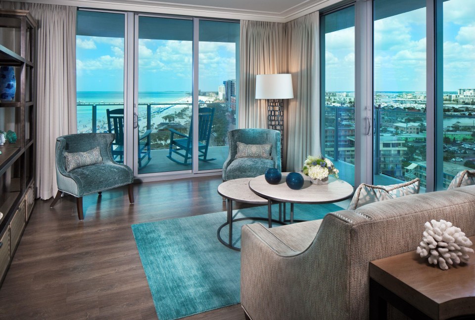 a living room with a view of the ocean