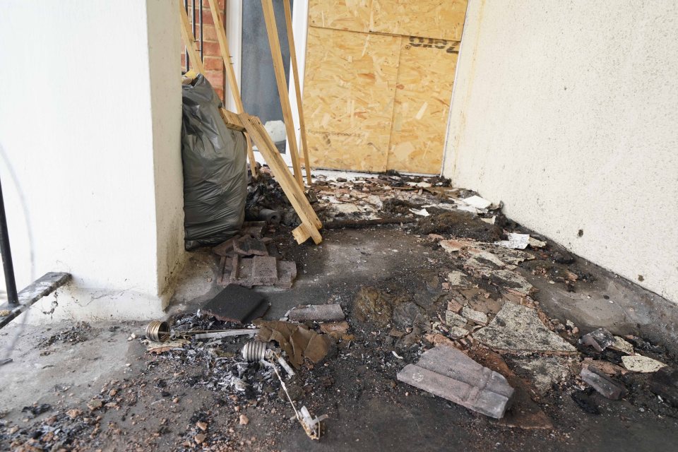 The balcony is covered in thick black rubble