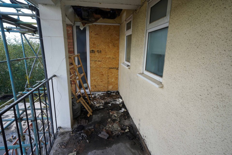 One of the doors to their home is boarded up