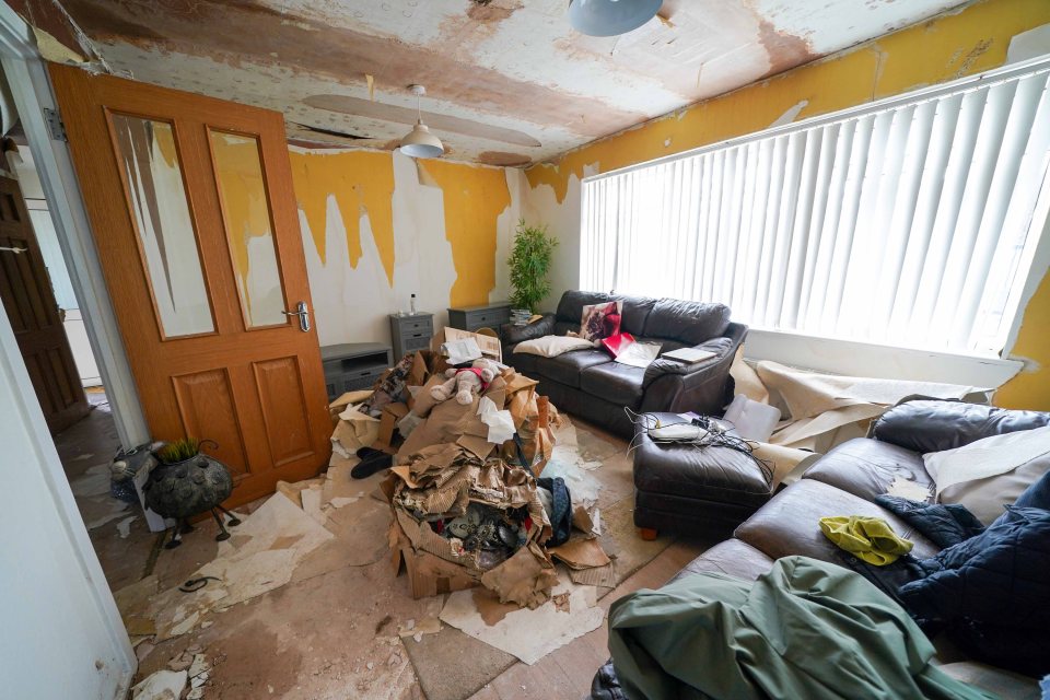 Piles of rubbish and plaster mount up in the living room