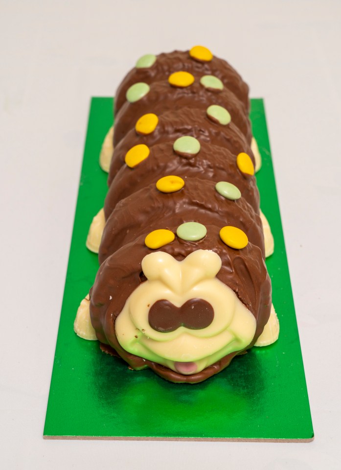 a chocolate caterpillar with yellow and green spots on it