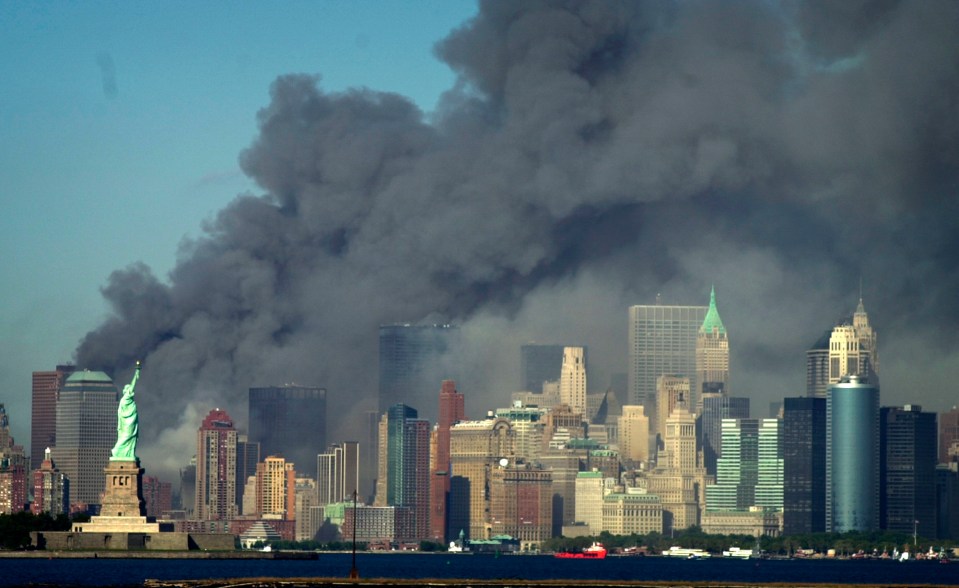 Smoke pours above the New York skyline after the 9/11 attack