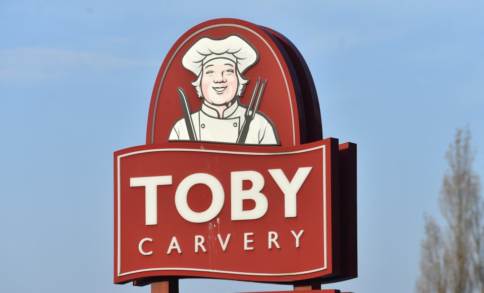 a toby carvery sign with a chef on it