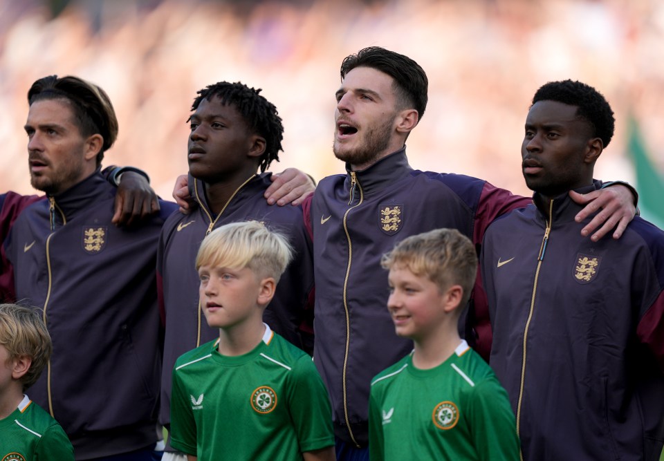 Jack Grealish, Kobbie Mainoo, Declan Rice and Marc Guehi sing the national anthem