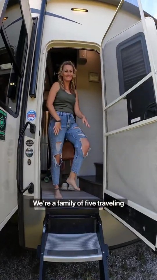 a woman standing in the doorway of a rv with the caption we 're a family of five traveling